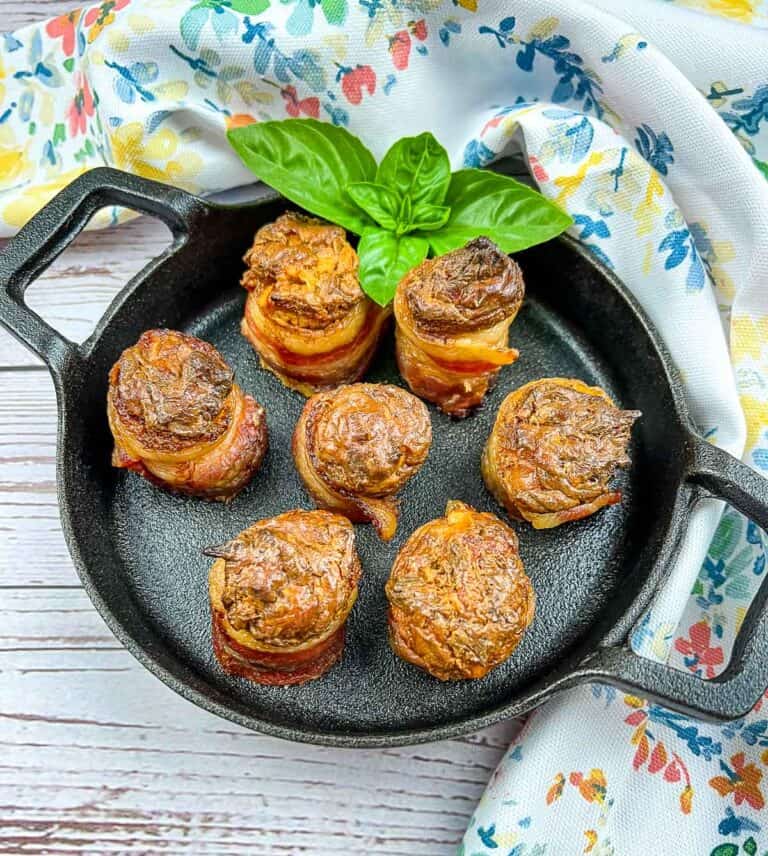 smoked pork shots on a black cast iron dish