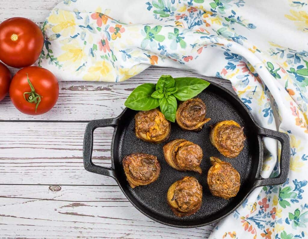 smoked pork shots in a black cast iron dish