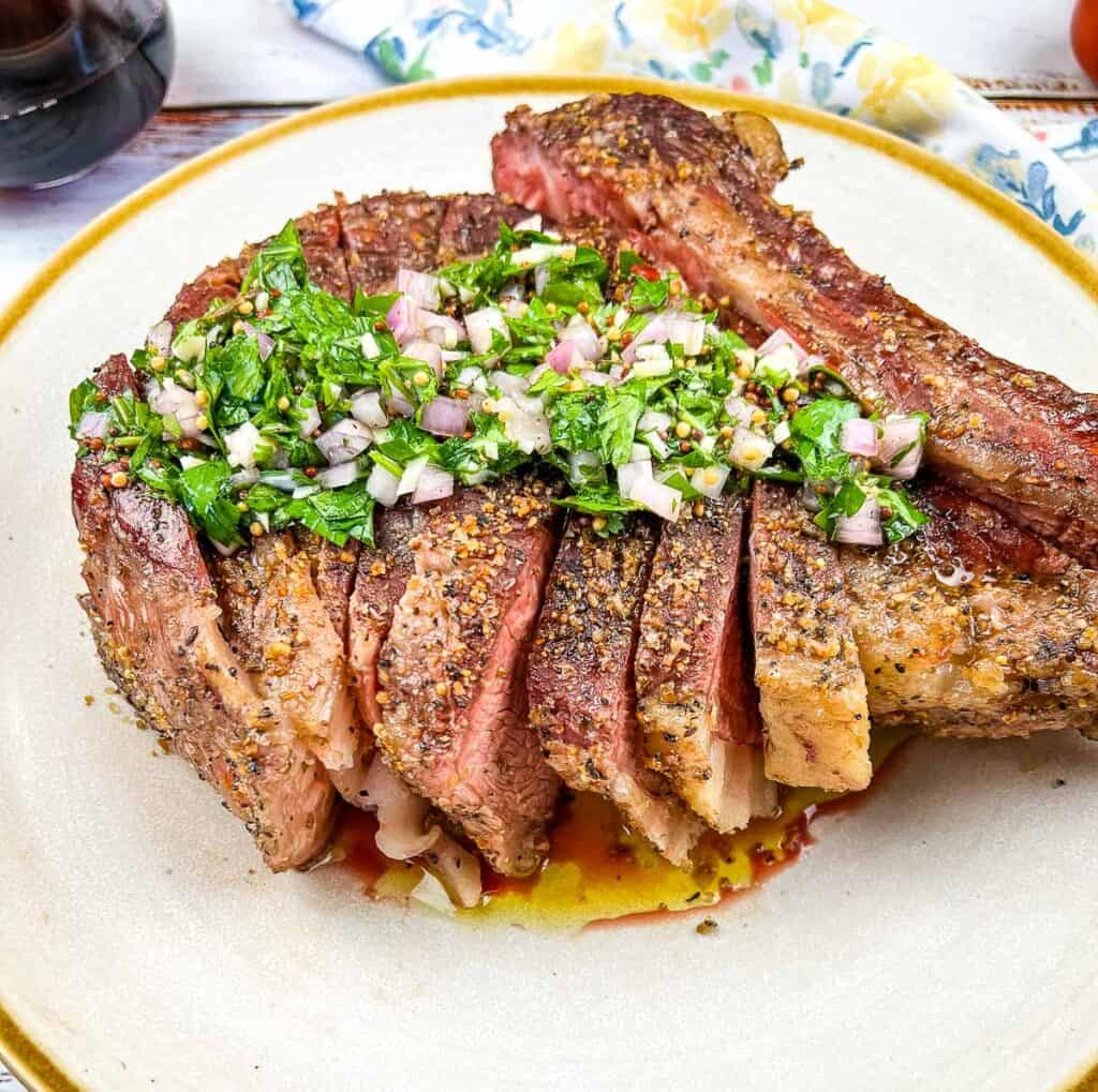 smoked tomahawk steak on a plate