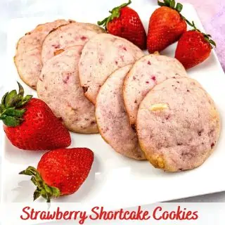 strawberry shortcake cookies on a plate with strawberries