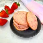 strawberry shortcake cookies stacked on a plate