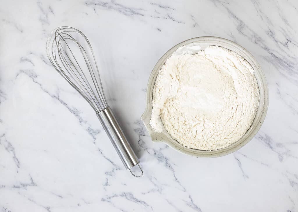 In a separate bowl, whisk together the flour, baking powder, and salt.