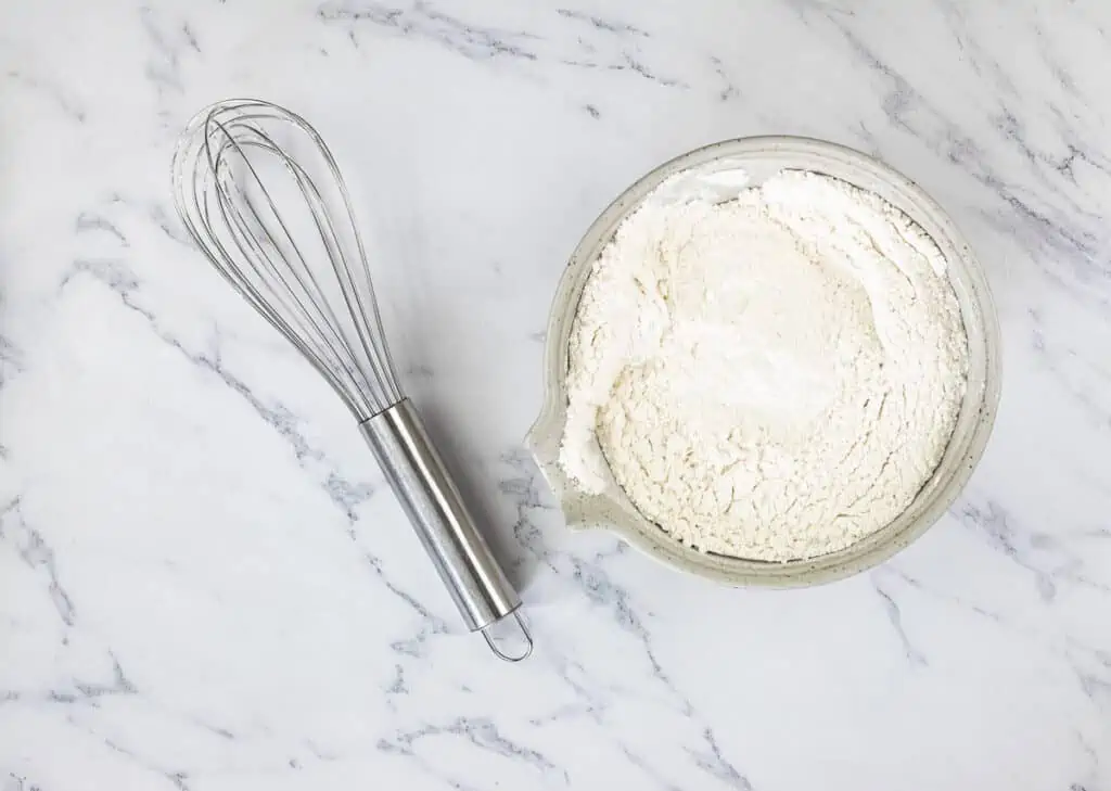 In a separate bowl, whisk together the flour, baking powder, and salt.