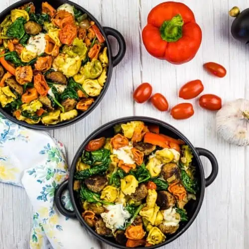 Blackstone Tortellini with Meatballs on two black plates