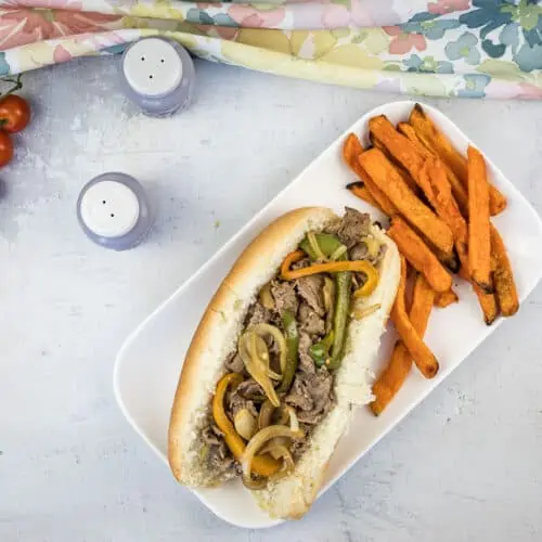 blackstone philly cheesesteak sandwich with sweet potato fries