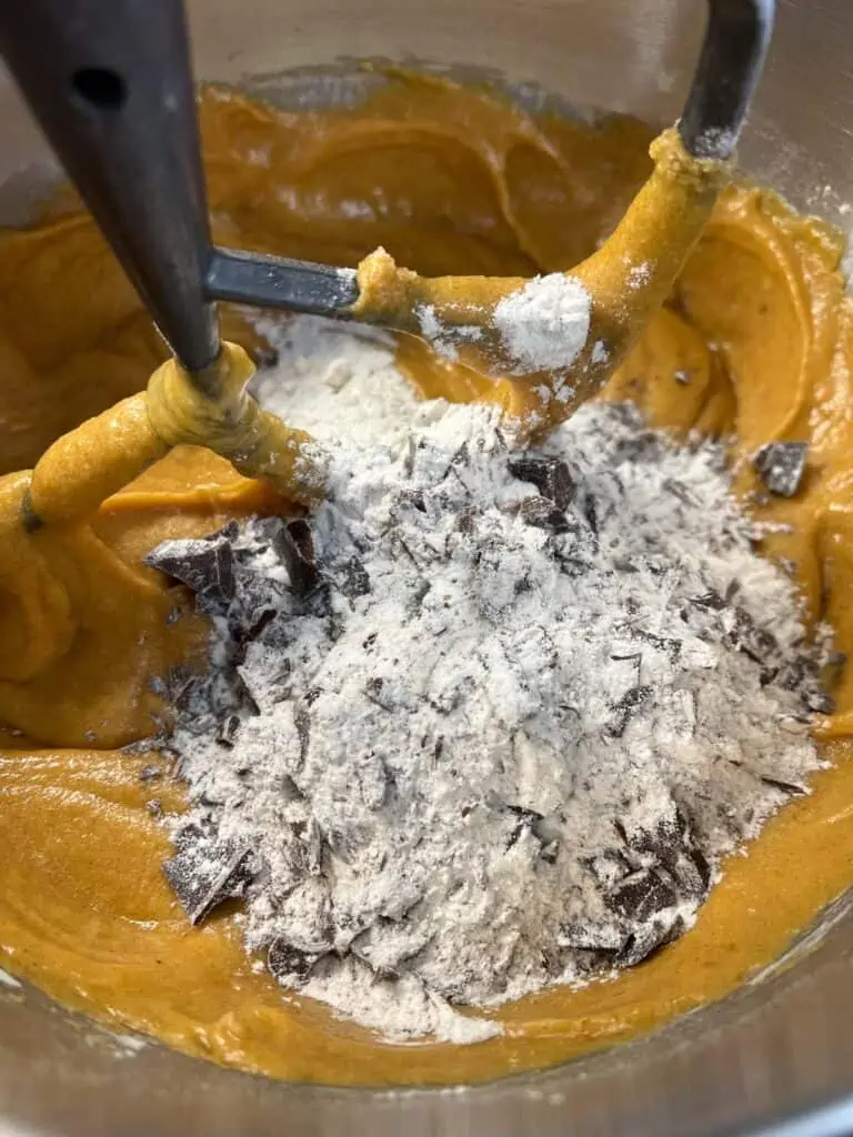 adding chocolate chunks to the batter