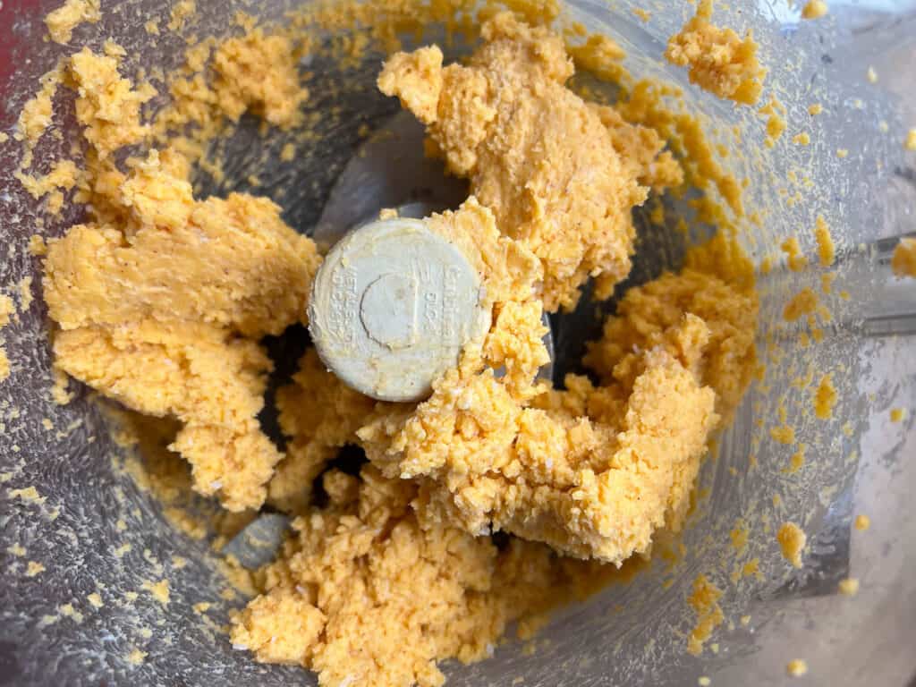 cheese and butter mixed in a food processor