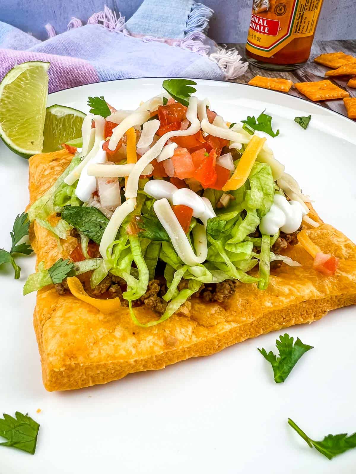 Cheez-It Tostada on a white plate.