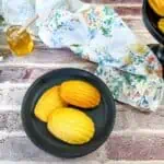 honey butter cornbread madeleines on a black plate