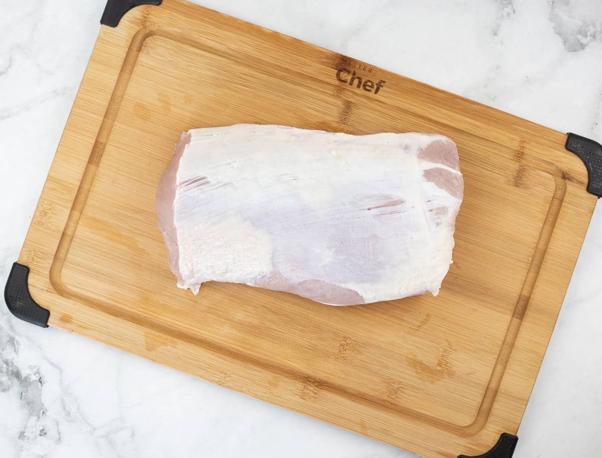 pork loin on a cutting board ready for the spice rub