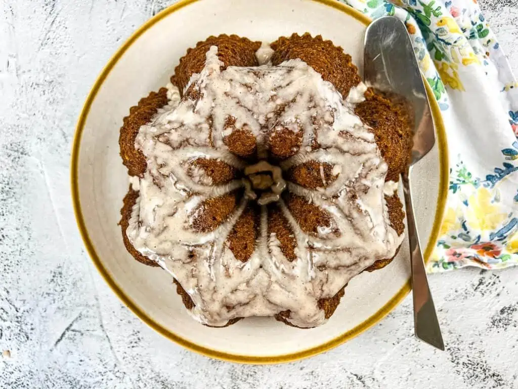 A cake with glaze drizzled on top.