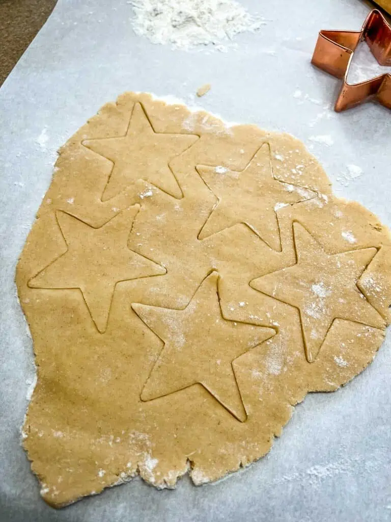 rolled eggnog sugar cookie dough with cutouts