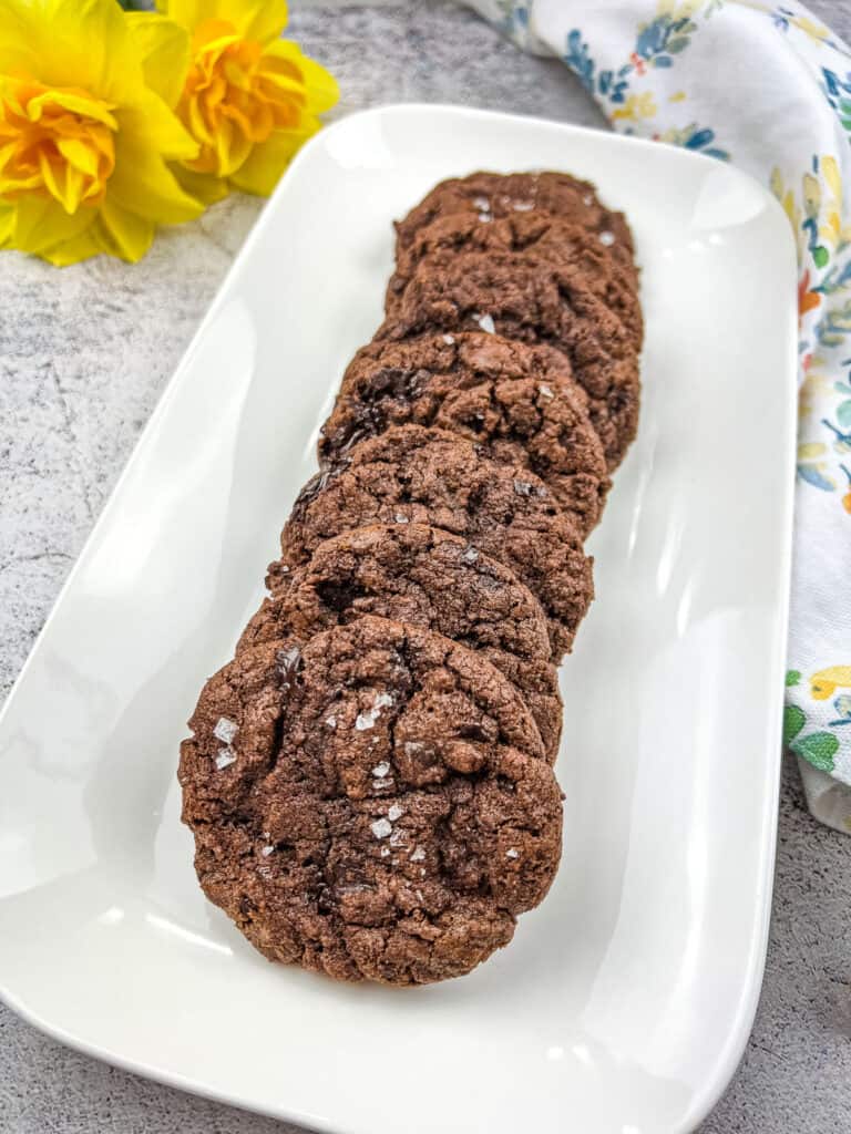 salted dark chocolate cookies on a plate
