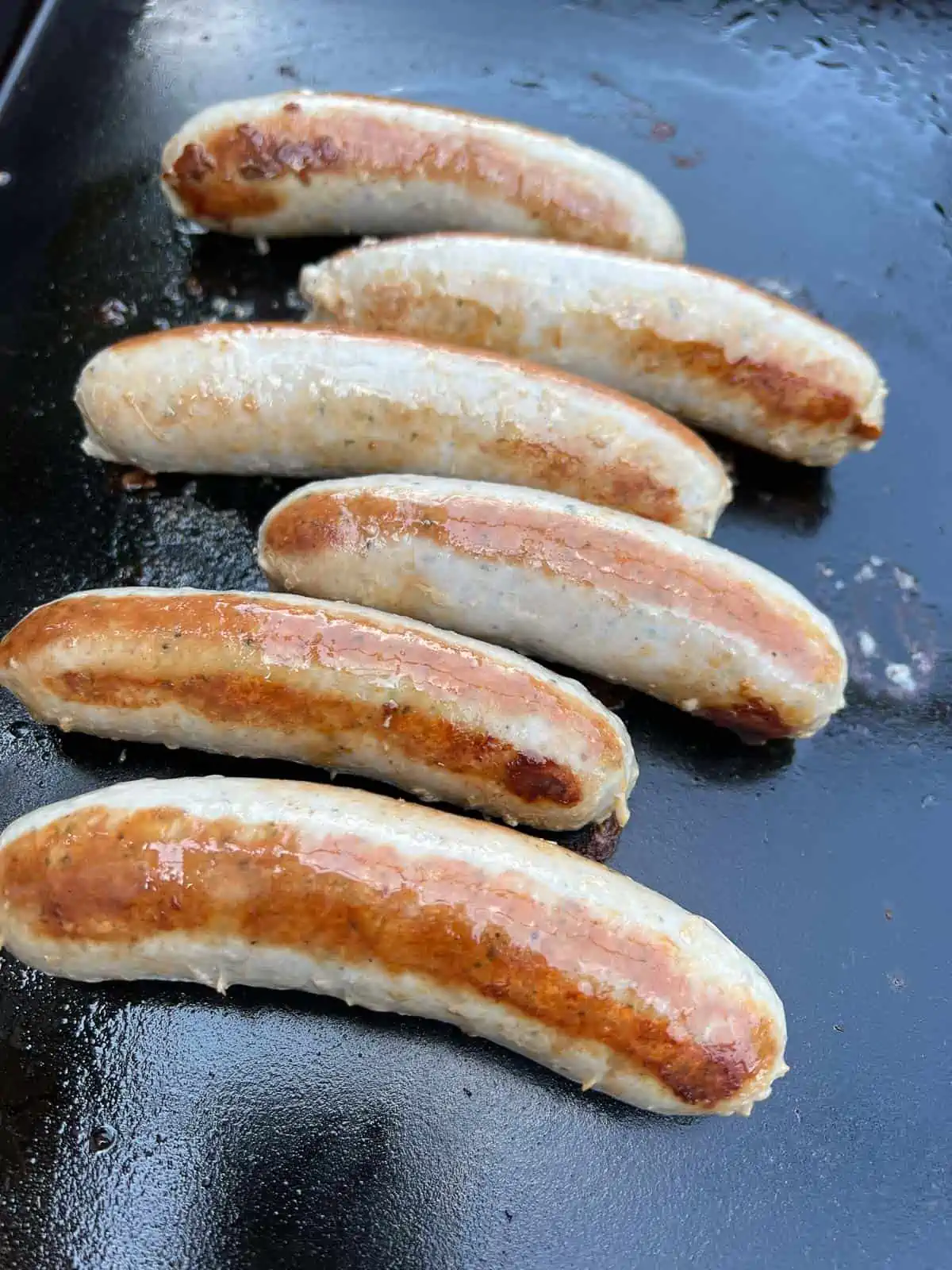 perfectly cooked sausage on a blackstone griddle