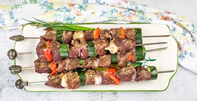 Smoked Beef Kabobs on a white platter.