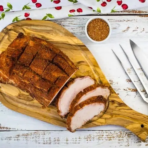 sliced smoked pork loin on a cutting board