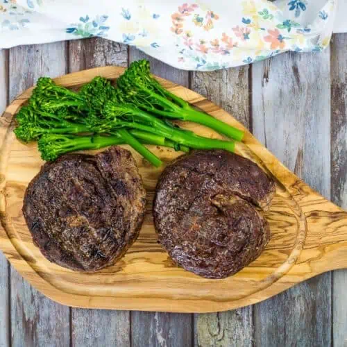 smoked ribeye cap steaks on a cutting board