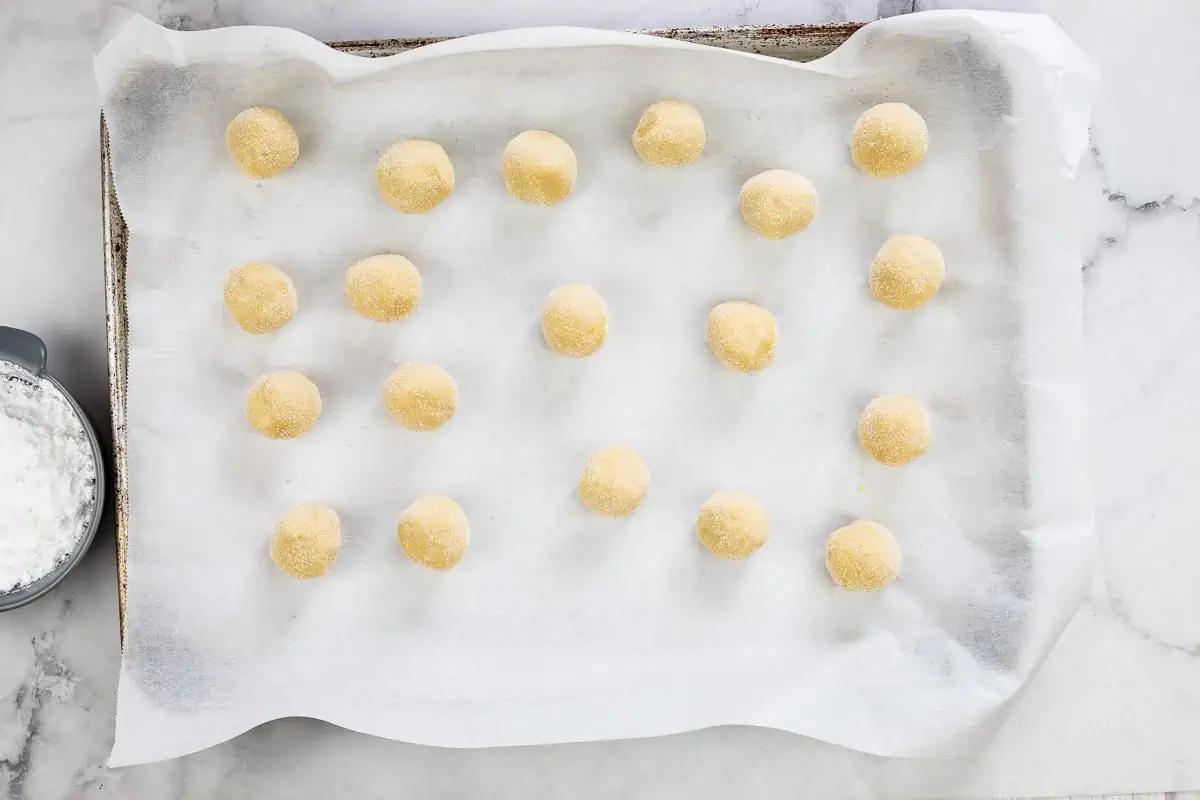 white chocolate crinkle cookie dough balls rolled in sugar