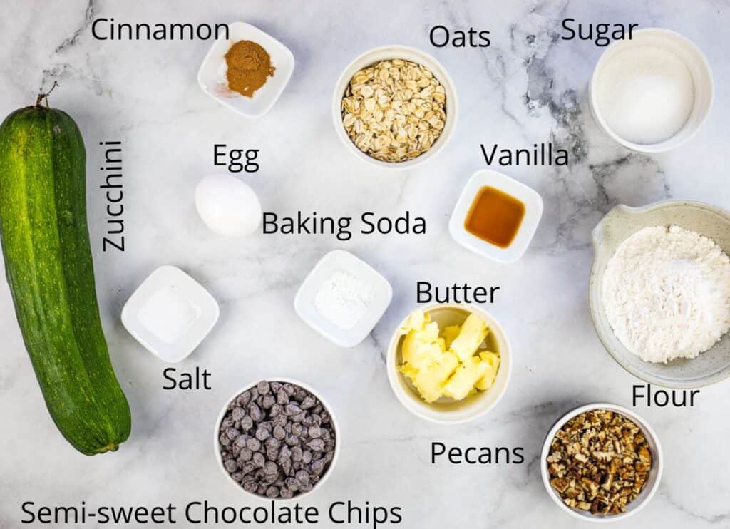 Ingredients to make zucchini cookies with chocolate and pecans.
