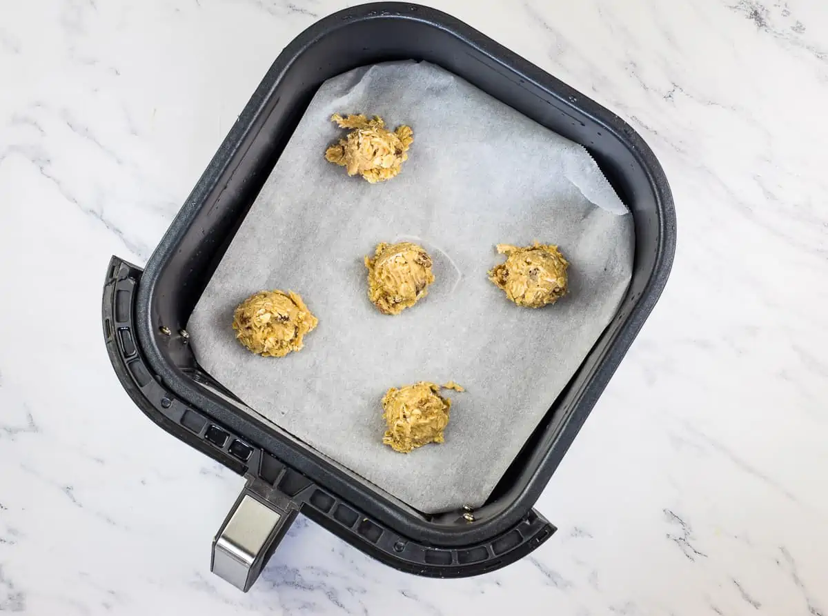 Cookies scooped and in air fryer basket.