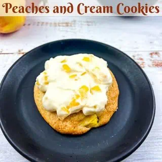Peaches and Cream cookie on a black plate.