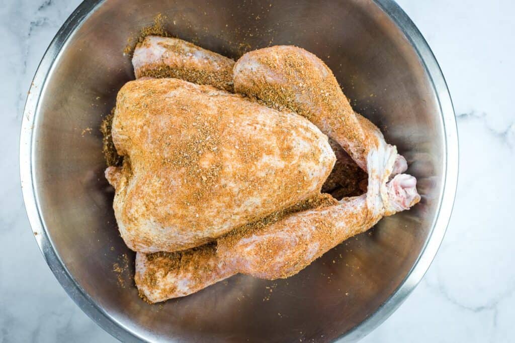 Raw turkey rubbed with the spices.
