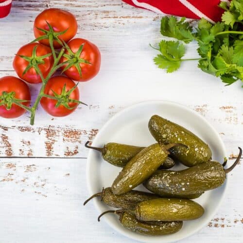 Smoked jalapenos on a plate.