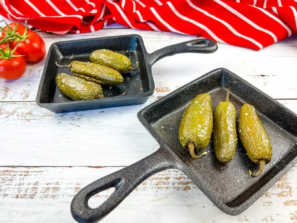 smoked jalapenos on square cast iron dishes.