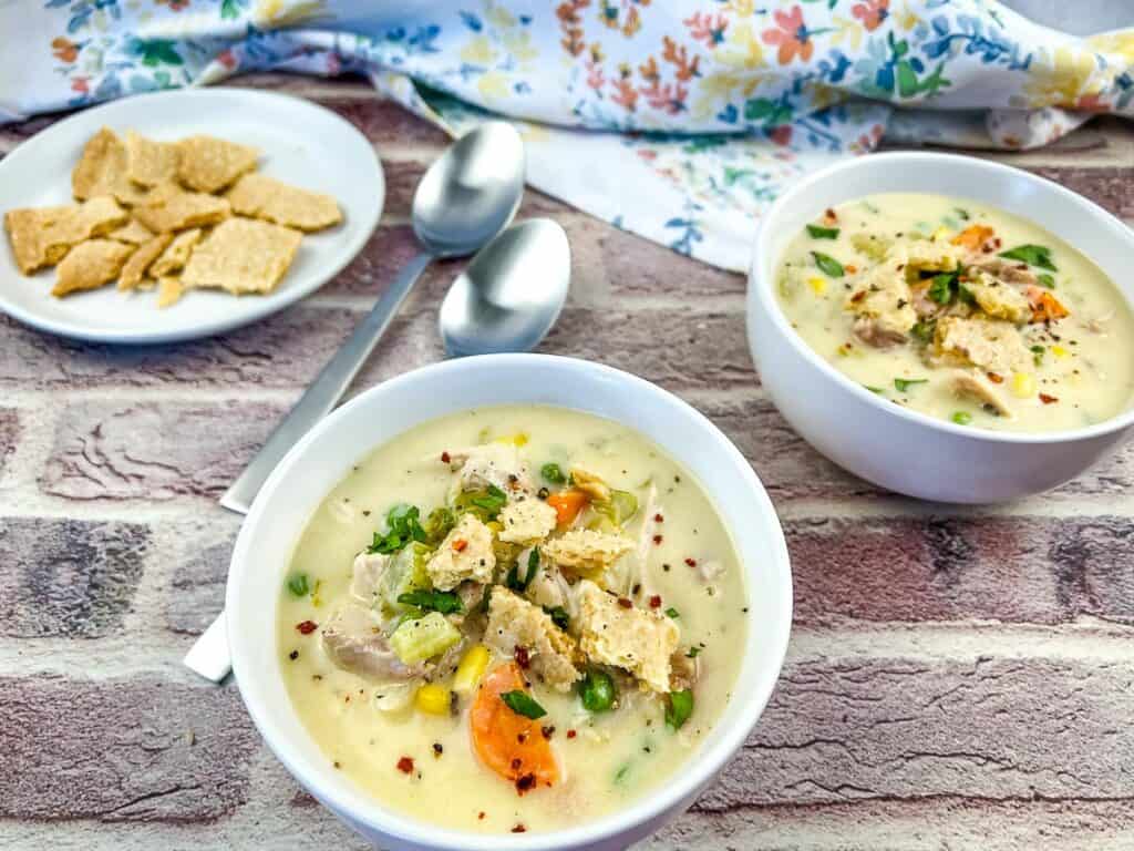 Smoked Turkey Pot Pie Soup in soup bowls.