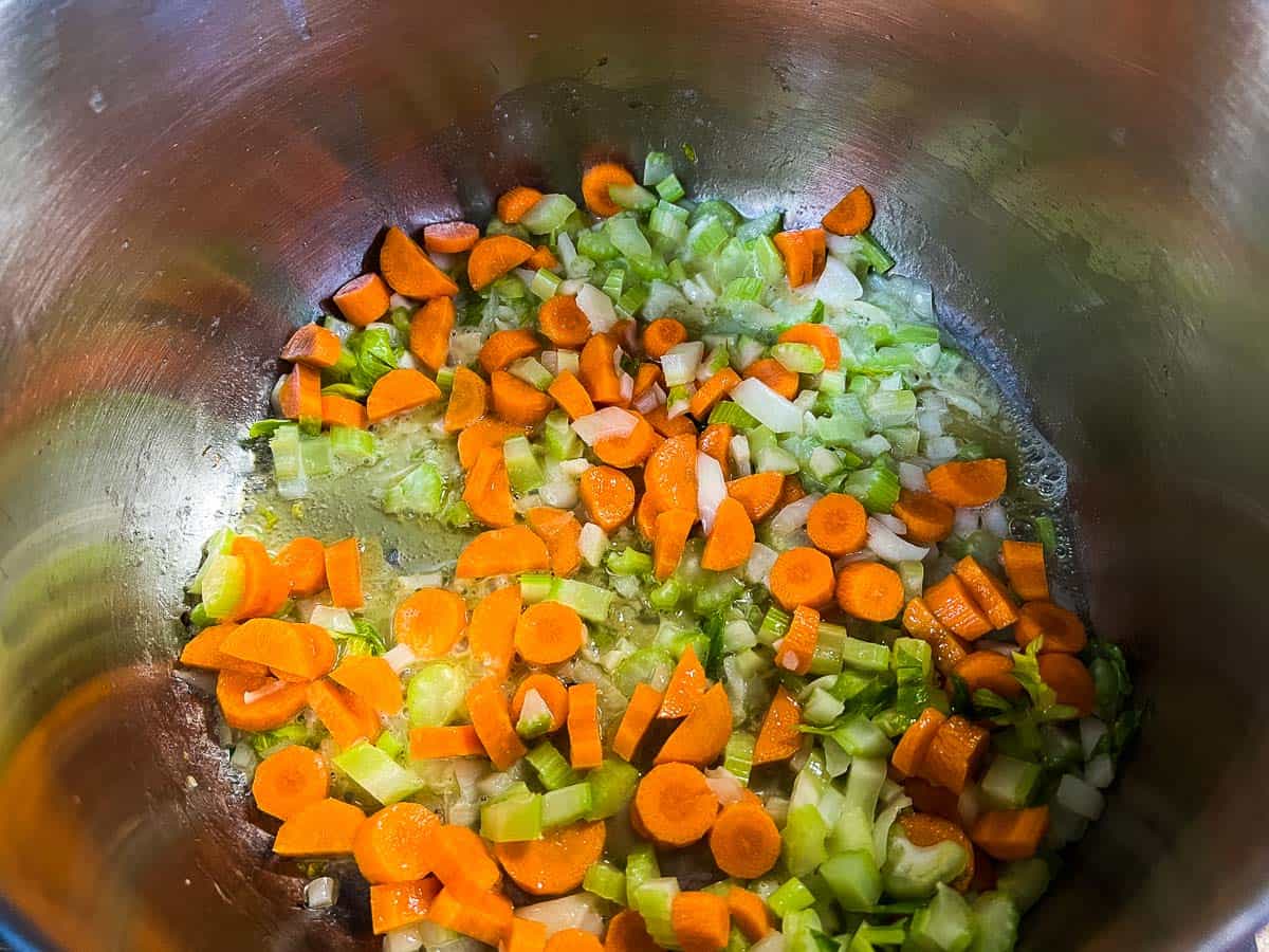 Sweating the veggies in a pot.
