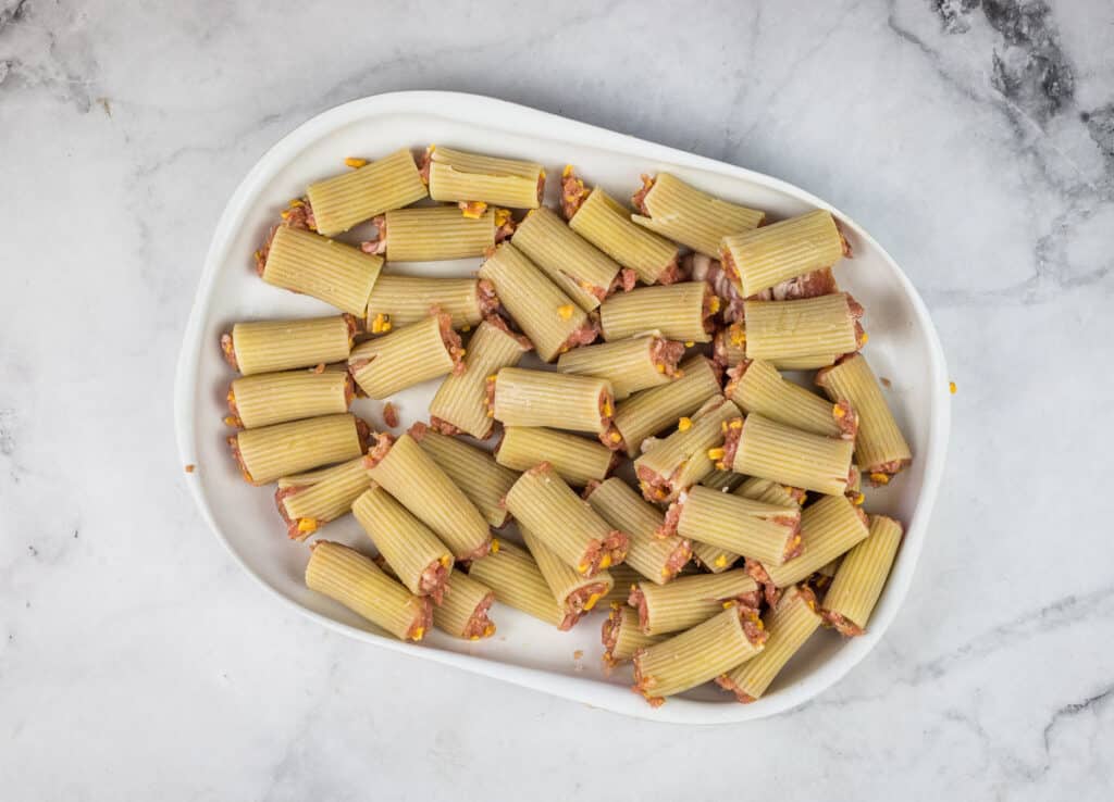 A plateful of stuffed rigatoni noodles.