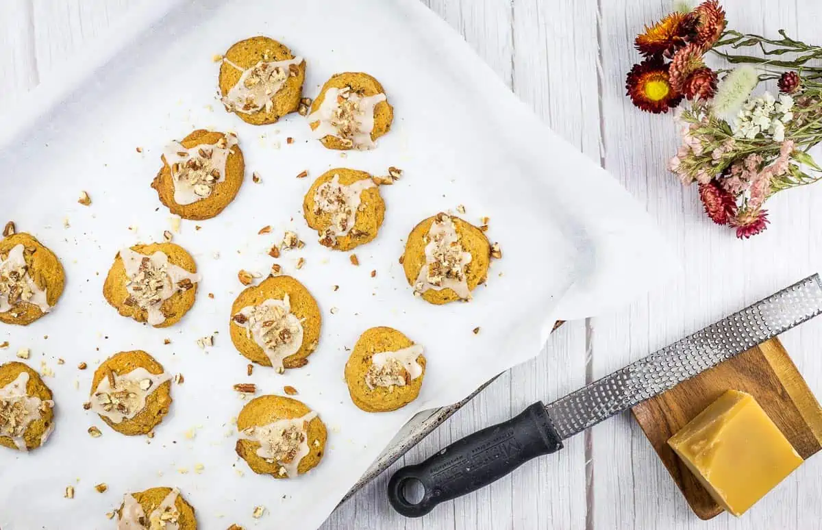 Cooked sweet potato cookies on a baking sheet.