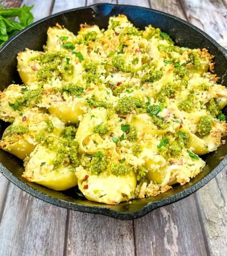Turkey Stuffed Shells with Pesto in a black cast iron pan.