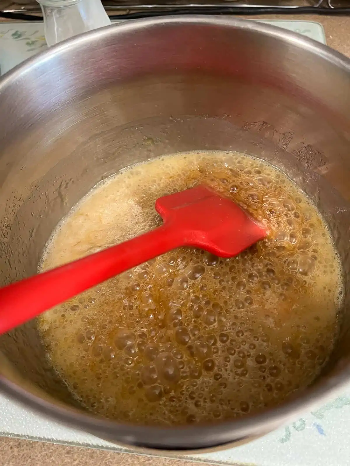 Cream and vanilla added to hot sugar mixture.