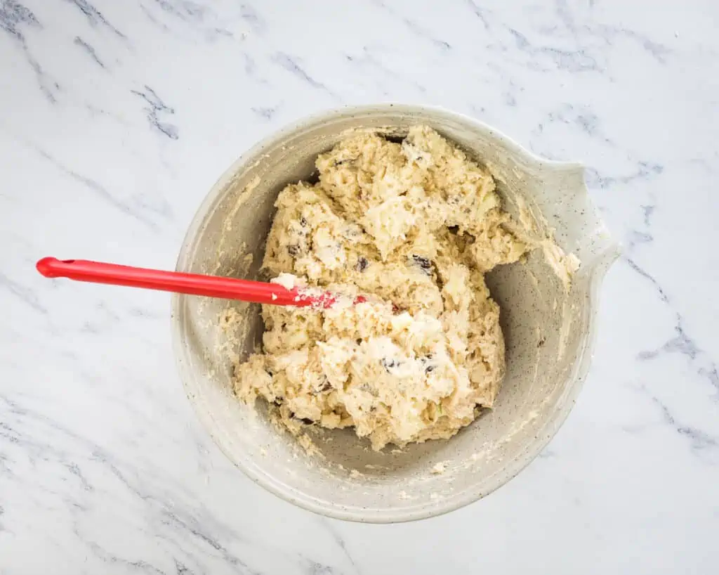 Apple, Date, and Walnut Muffin batter mixed in a bowl.