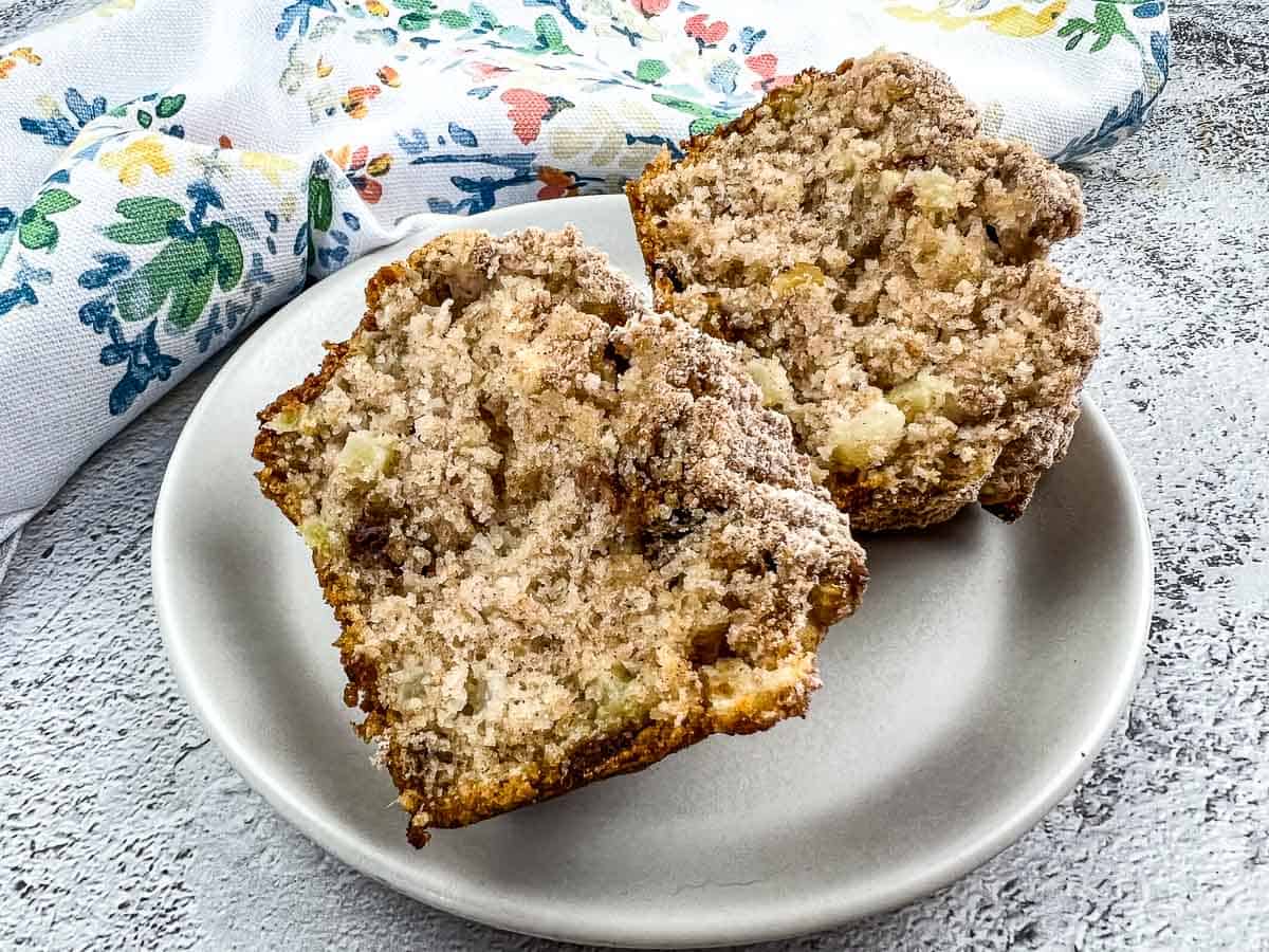 A cut muffin on a plate.