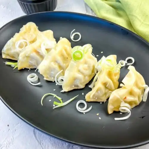 A plate of potstickers cooked on a Blackstone Griddle.