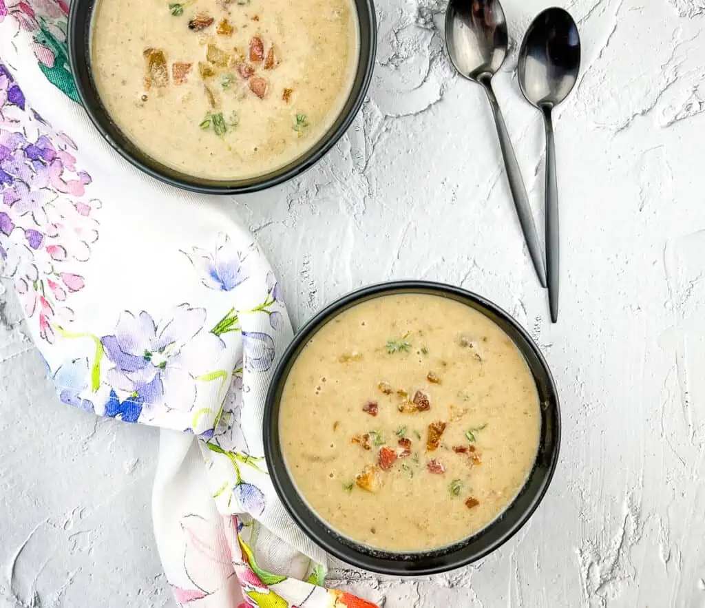 Two servings of Caramelized Onion and Mushroom Soup finished with cream and seasoned.