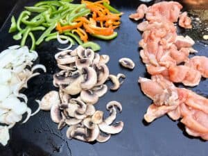 Blackstone Chicken Philly Cheesesteaks - Cook What You Love
