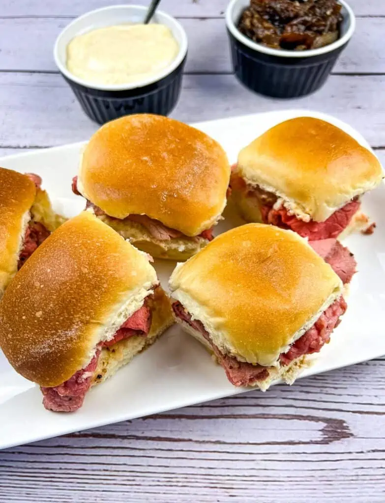 Smoked French Dip Sliders on a white platter.