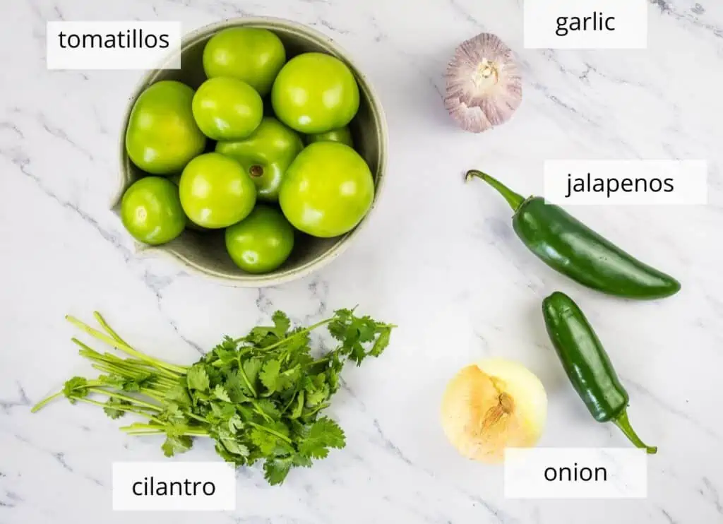 Labeled ingredients to make tomatillo sauce.