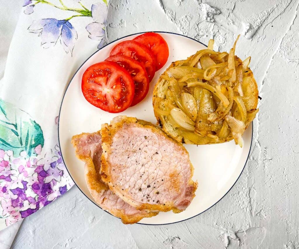 Peameal bacon sandwich with onions.