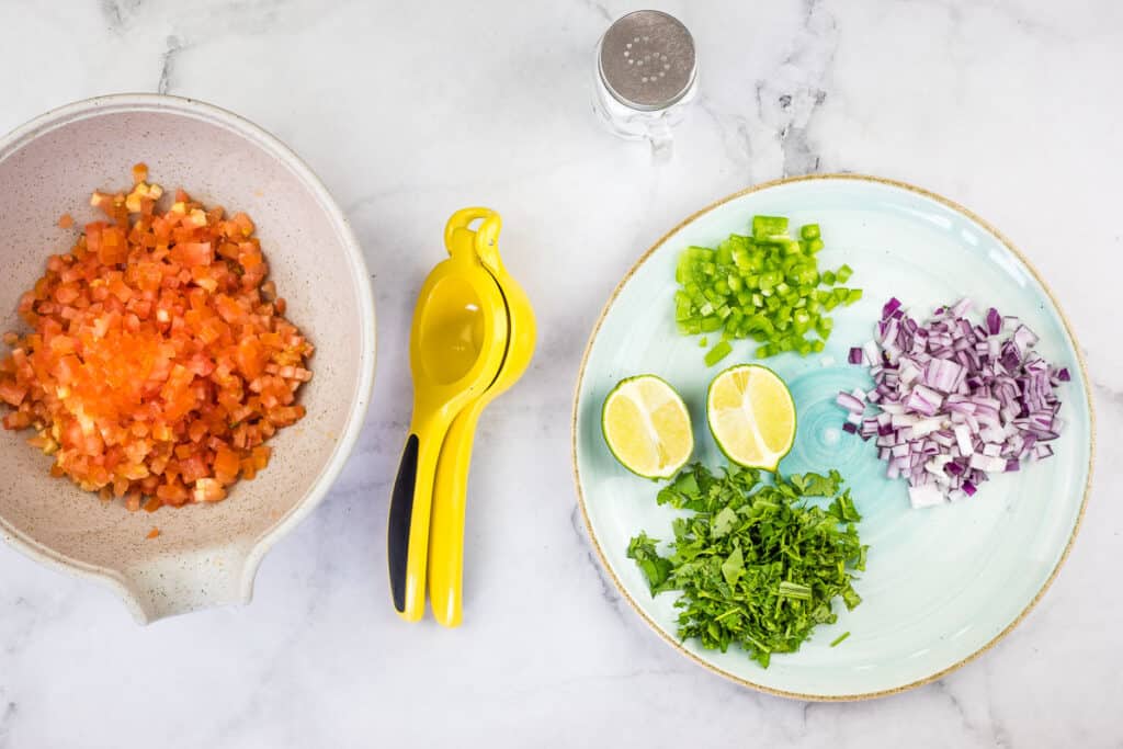 Prepped ingredients on a plate and in a bowl.