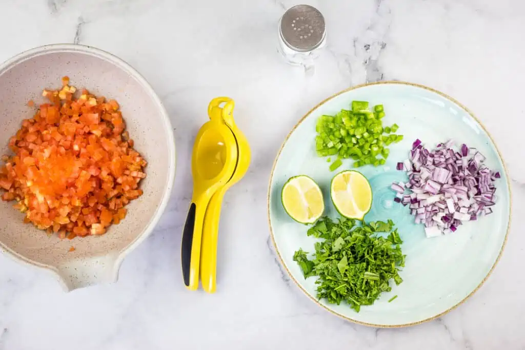Prepped ingredients on a plate and in a bowl.