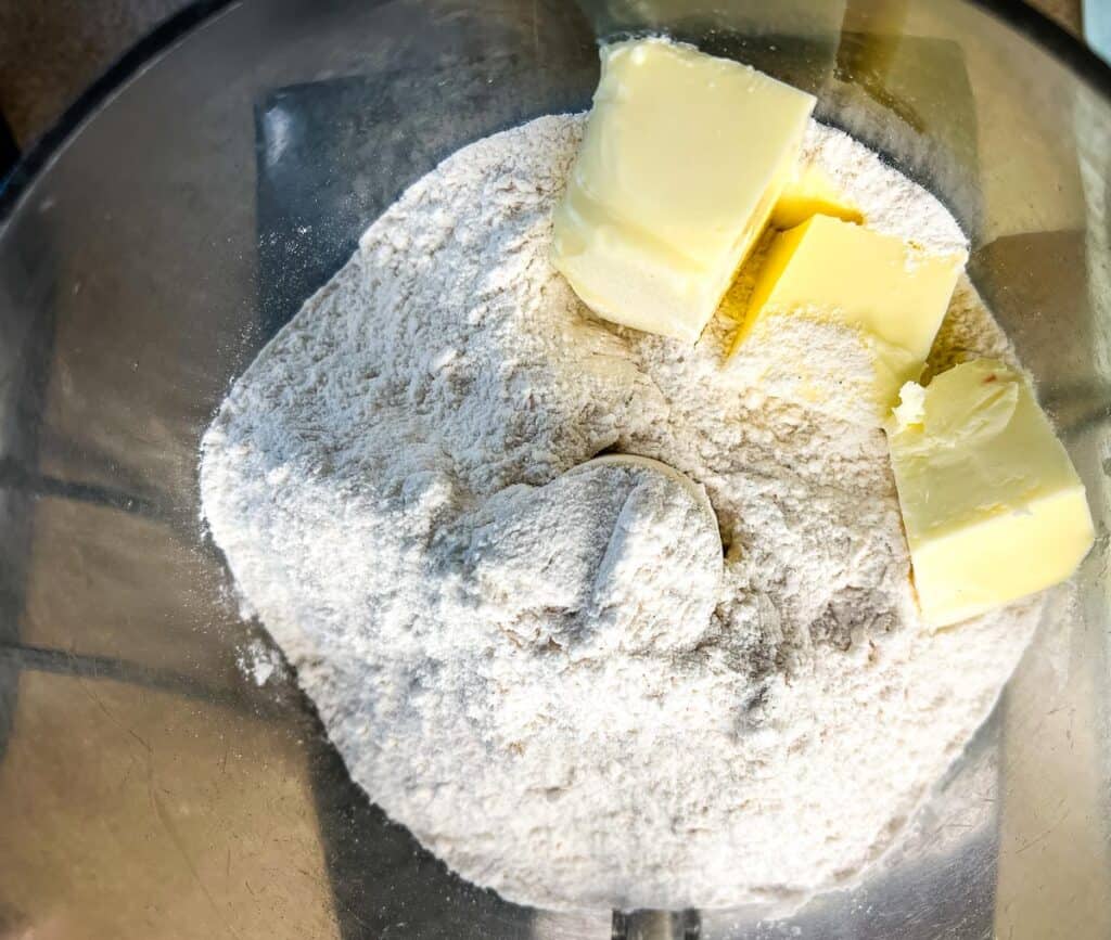 Butter and dry ingredients in a food processor.