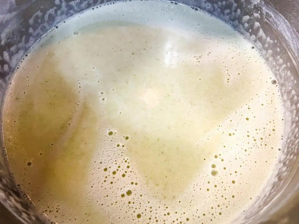 Simmering the soup with the added cream.