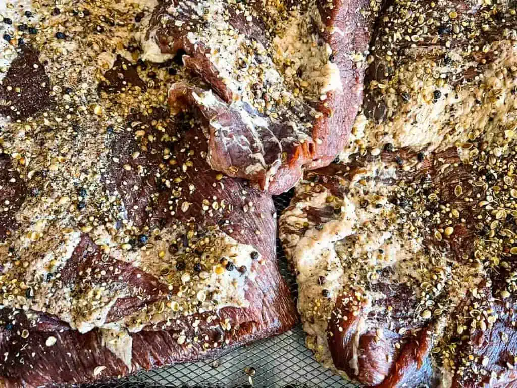 Brisket rubbed with spices.