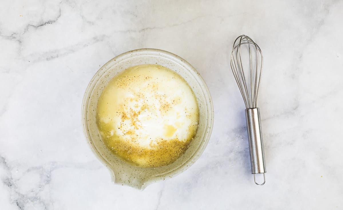 The lemon, vinegar, yougur, and sugar in a bowl to make the dressing.