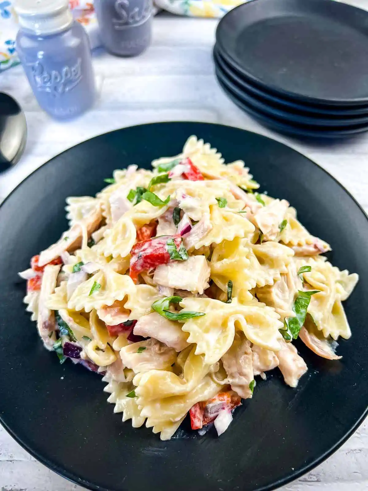 Finished Rotisserie Chicken Pasta Salad in a black serving bowl.