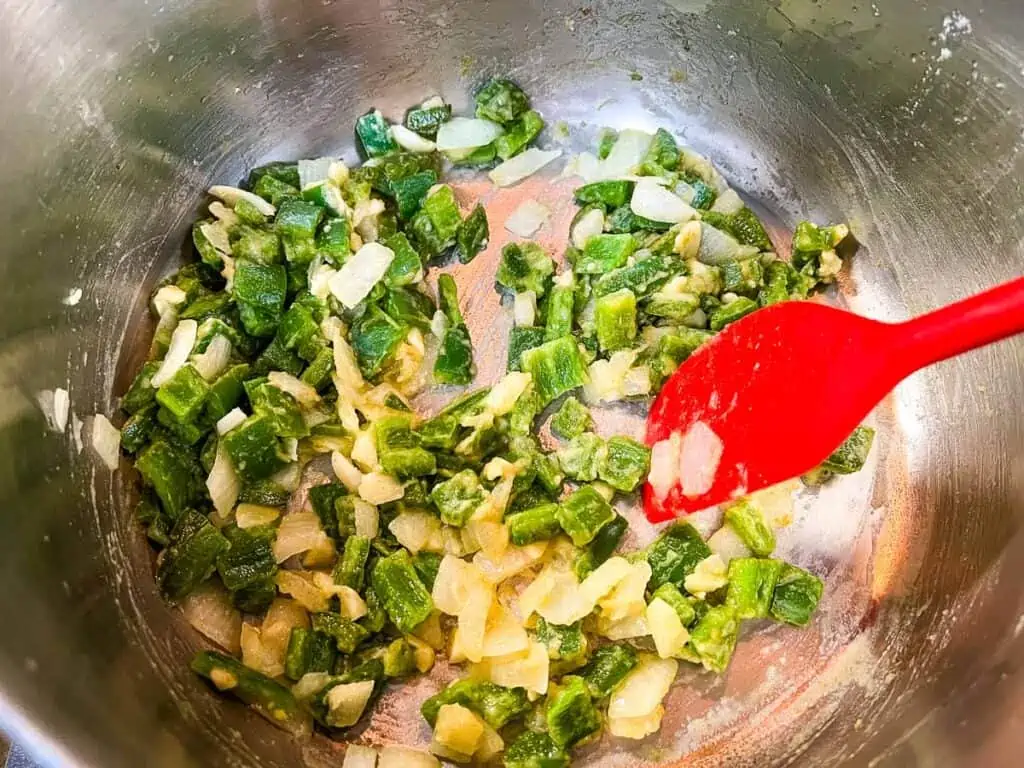 Garlic added to the sautéed veggies.